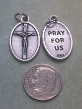 Load image into Gallery viewer, Crucifix oval holy medal - silver oxide - Catholic - Jesus Christ, Passion of our Lord, Cross, God is Love, Mercy, Salvation
