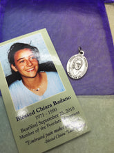 Load image into Gallery viewer, Blessed Chiara Badano prayer card and holy medal gift set - embraced pain makes one free.
